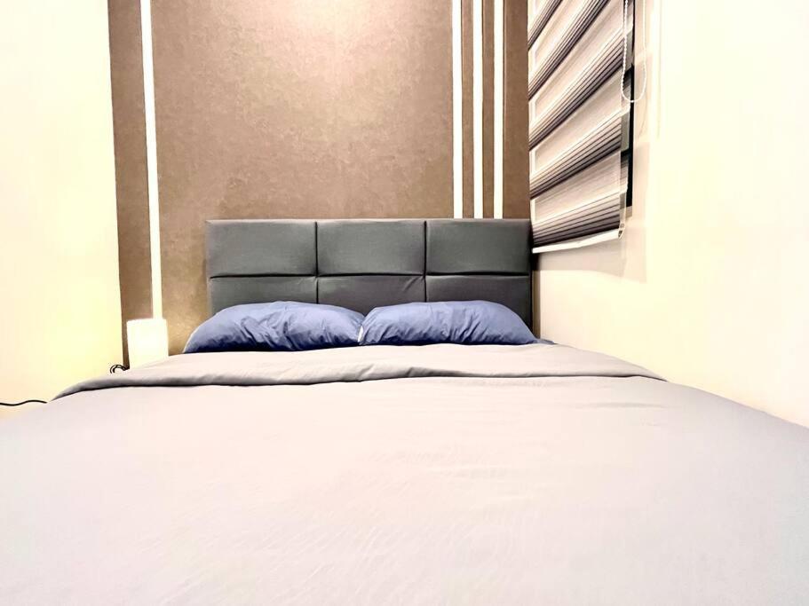 Apartment Grand @ The Wave Residence-cozy 2-br Retreat: Ac, Street Views & Games *